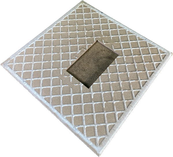 electrical socket hole waterjet cut in a ceramic tile looking from the back