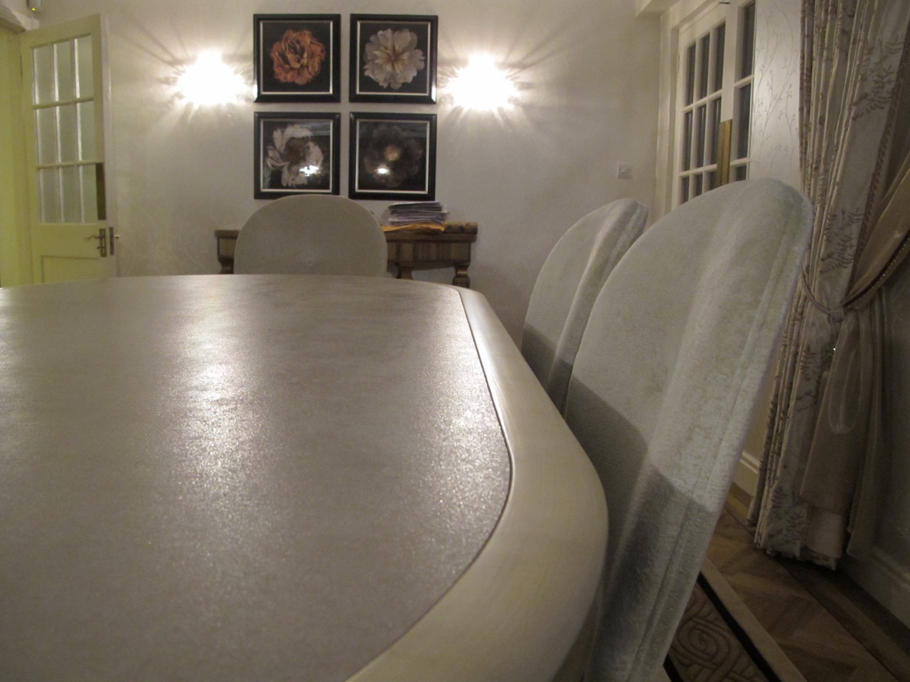 Large format ultra thin porcelain tile water jet cut into an oval shape for table inlay