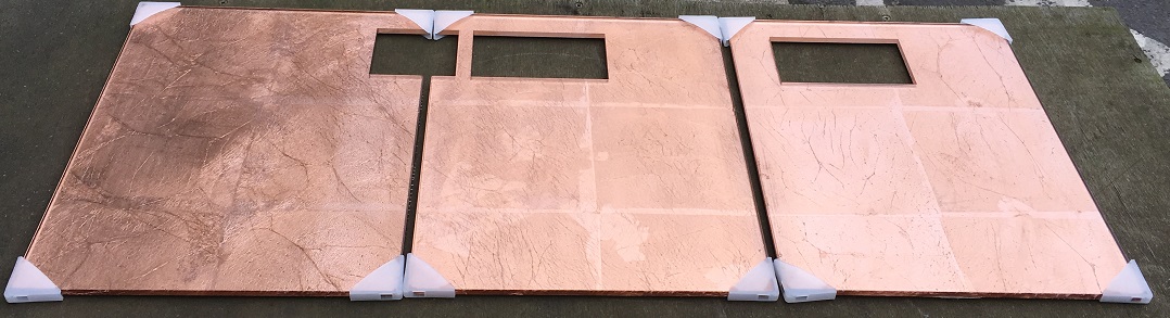 Glass Tiles with Copper leaf lamination waterjet cut to take electrical sockets