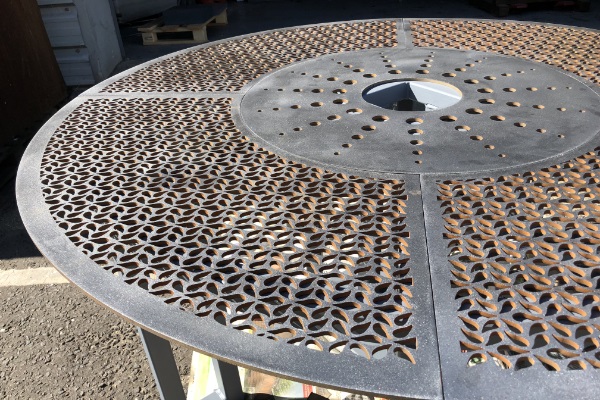 waterjet cut feature holes in corten steel fountain base 600 x 400