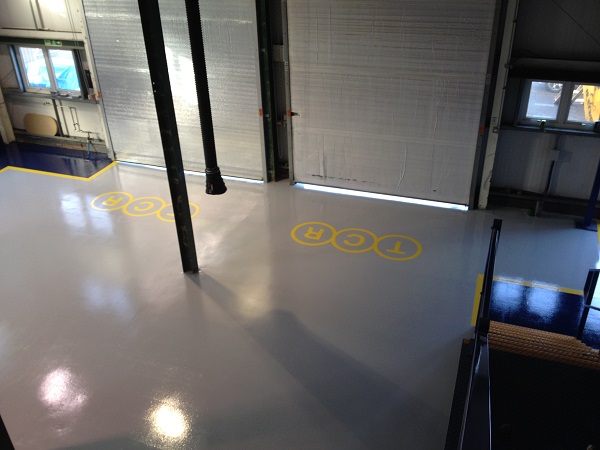 TCR company logo installed with yellow paint