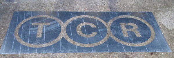 TCR company logo stencil in steel