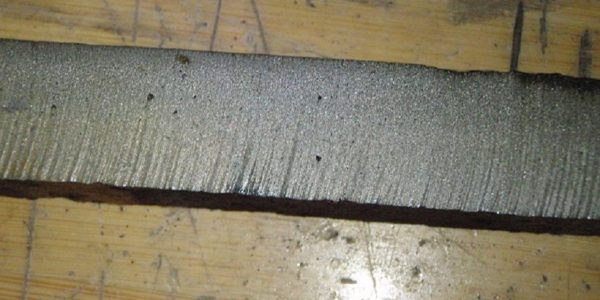 cast iron pipe section waterjet cut edge showing some flaws