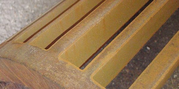 cast iron pipe section with strips waterjet cut from it cast iron pipe section with strips waterjet cut from it