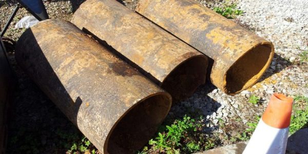 cast iron pipe sections as they were dug up from the ground