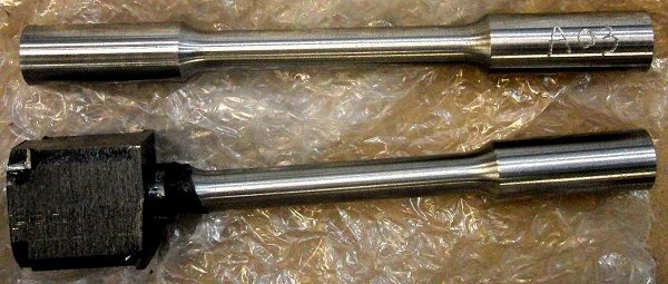 machined dumbell test specimens showing flaw machined dumbell test specimens showing flaw